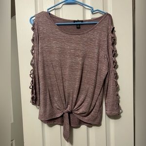 A. Byer mid-sleeve top cutouts on the sleeve & a tie knot on the bottom front !